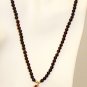 NK034 Rose Quartz Pendant in a Garnet Strand. Sterling Silver Beads and Clasps