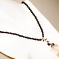 NK034 Rose Quartz Pendant in a Garnet Strand. Sterling Silver Beads and Clasps