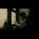 Boy Reading By a Window